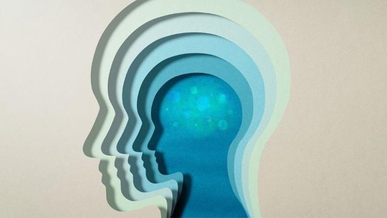 Gestileerde silhouetten van menselijke hoofden in lagen, met een verlichte hersenactiviteit in het middenhoofd.